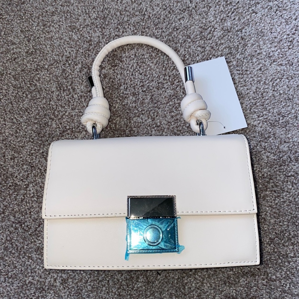 Never used. Can be used as crossbody or Handbag